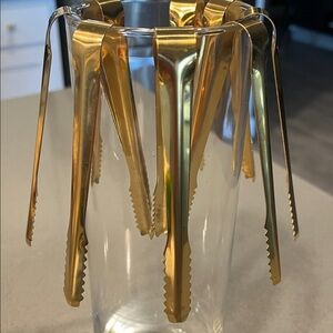 Eight Mini Gold Tongs
